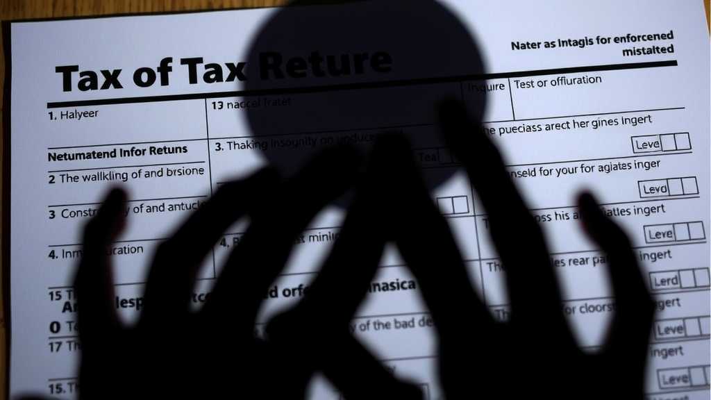 Tax return form with a shadowy figure